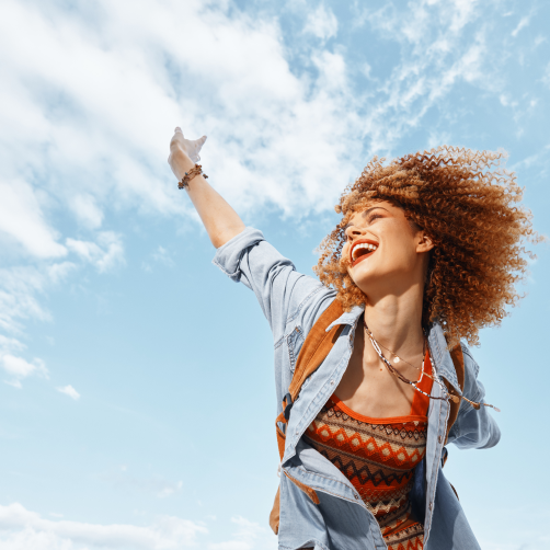 woman cheerfully dancing and smiling